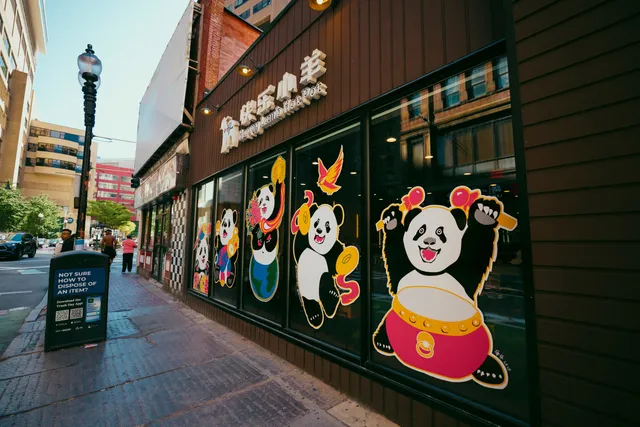 Panda mural painted across the windows of the Happy Lamb Hot Pot storefront on Washington Street in Boston’s Chinatown