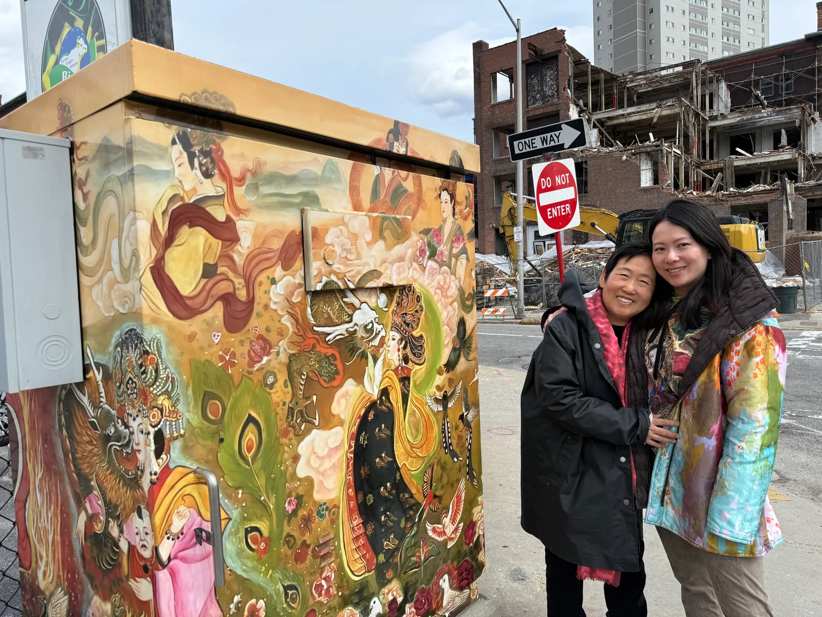 Xiang Li and Fei Wu standing in front of their WooBox in Worcester
