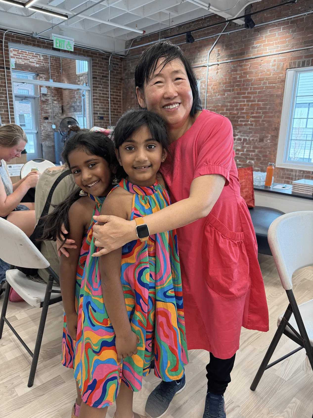 Xiang Li with children at multisensory art reception